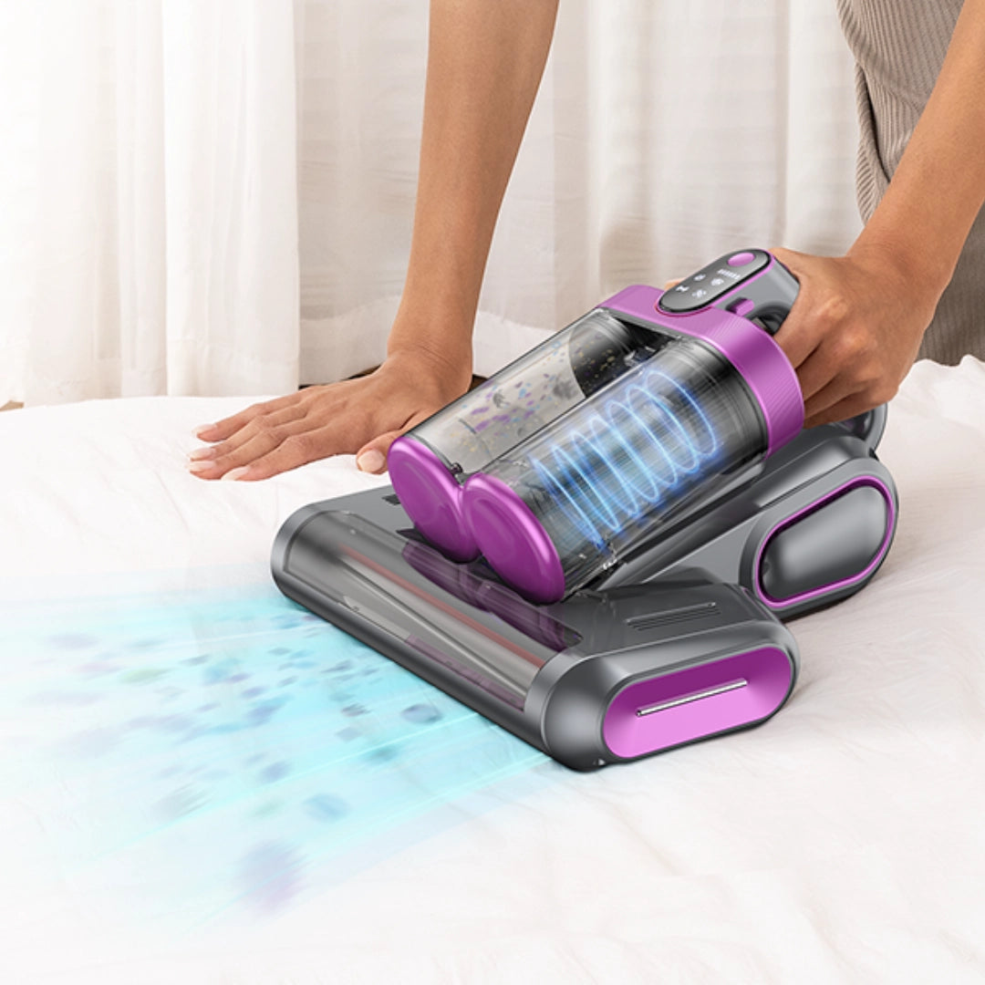 Cordless vacuum cleaner gently cleaning mattress with soft light