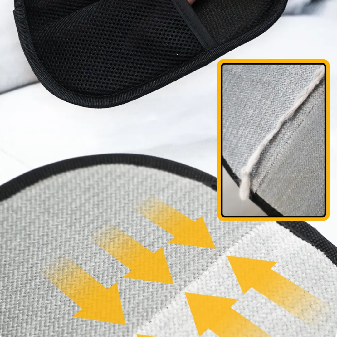 Close-up of dual-sided pet grooming glove with arrows highlighting the fur removal process.